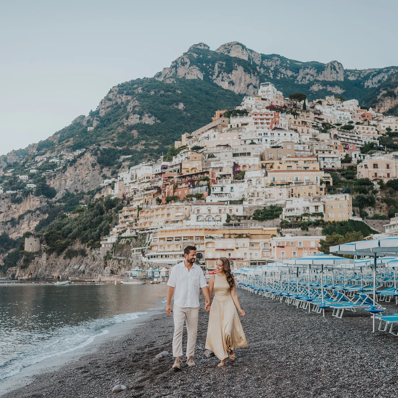 A couple together on the beach in Positano.